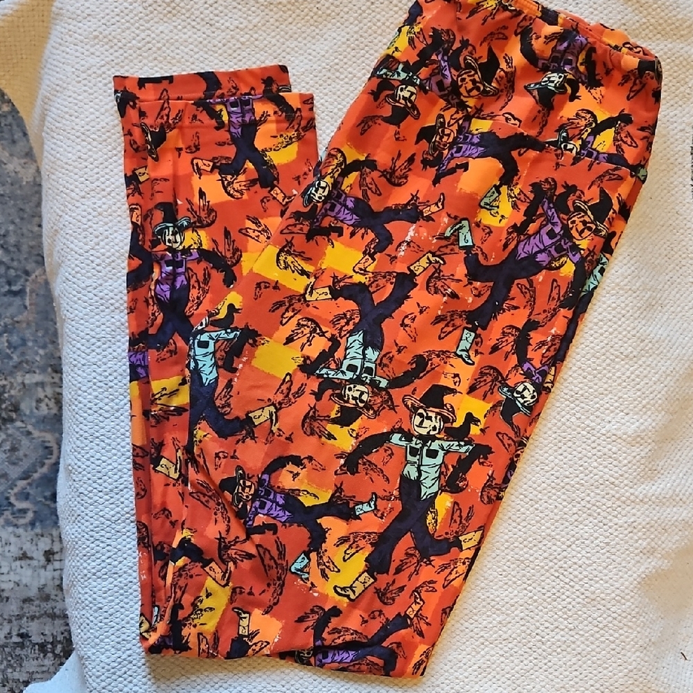 LuLaRoe Orange Scarecrow Print Leggings with Purple & Teal Accents